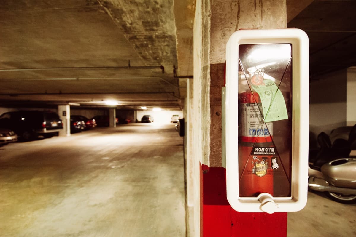 Cars parked in a shared apartment building parking area