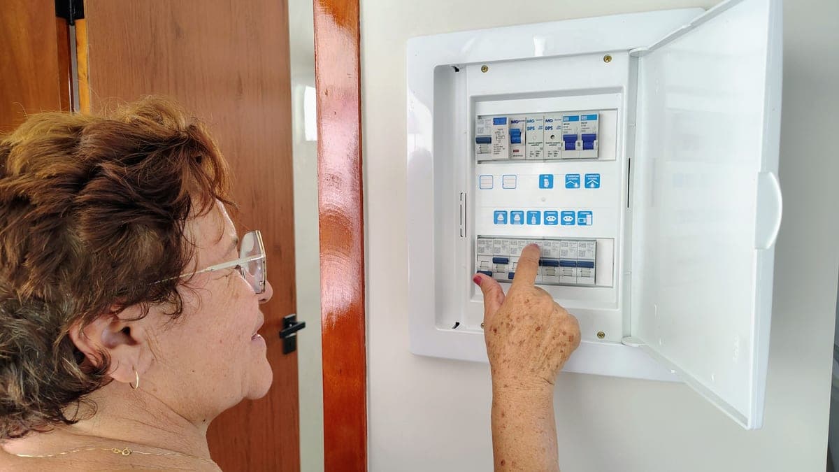 A residential electrical panel with the cover removed, showing circuit breakers