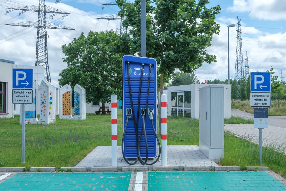 Several electric vehicles parked at charging points