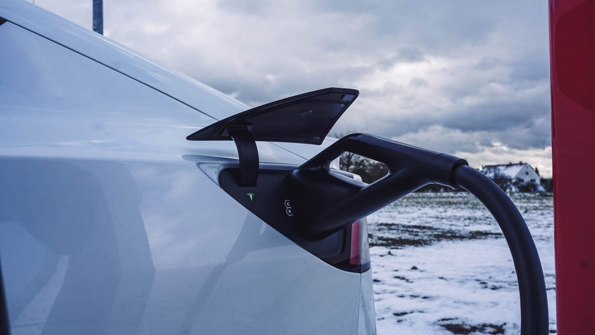 An electric car parked in snowy conditions