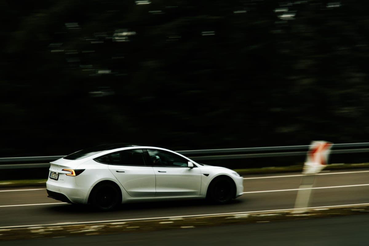 An electric car traveling on a highway