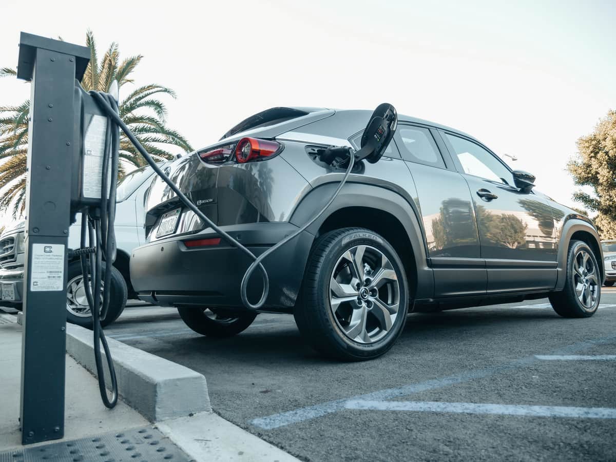 An electric SUV parked in a residential driveway