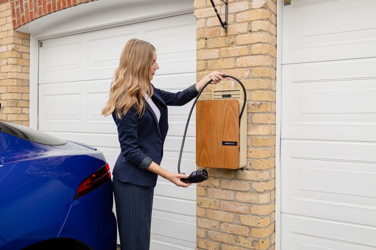 An EV charging unit mounted on a garage wall