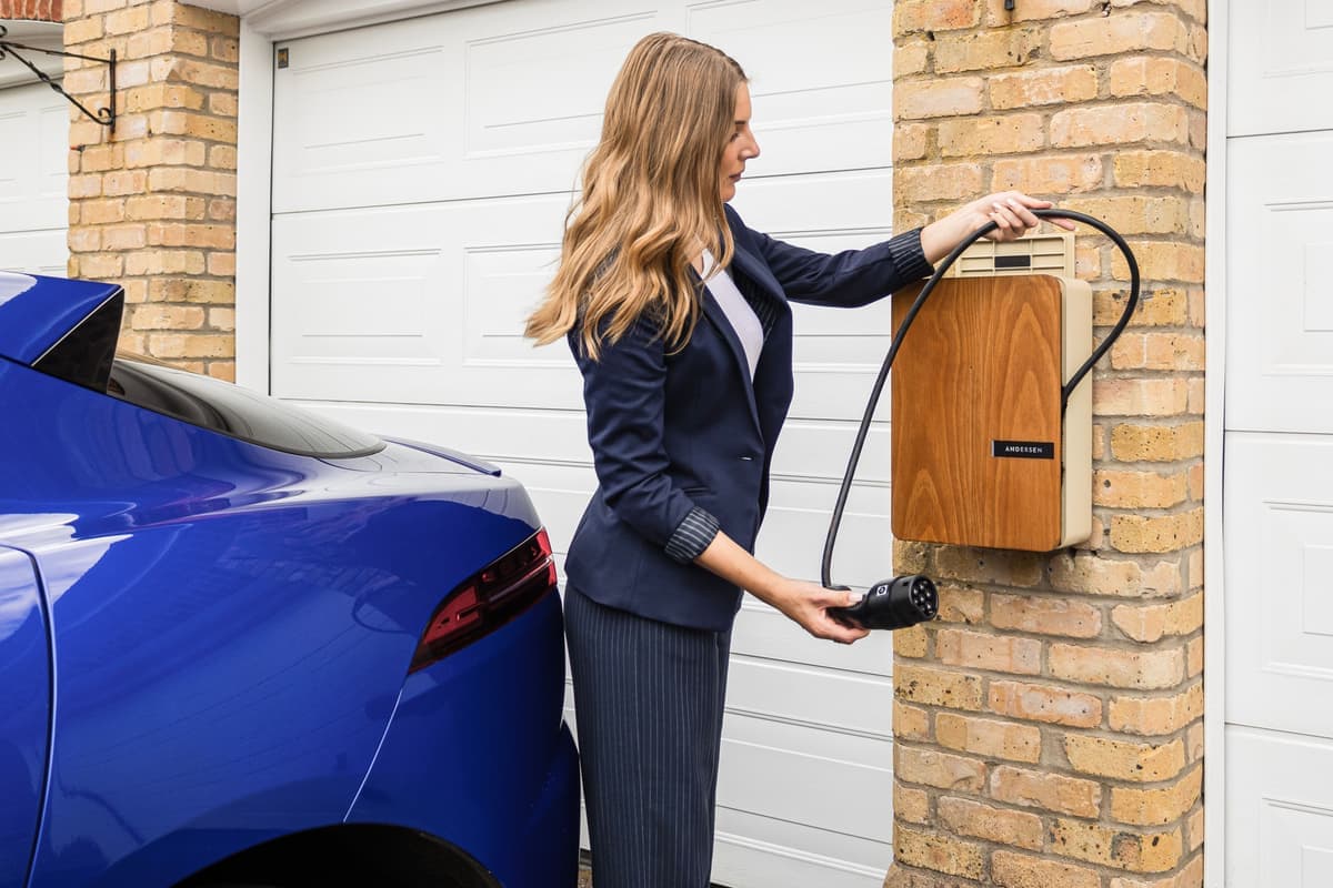 An electric car charging overnight in a home garage