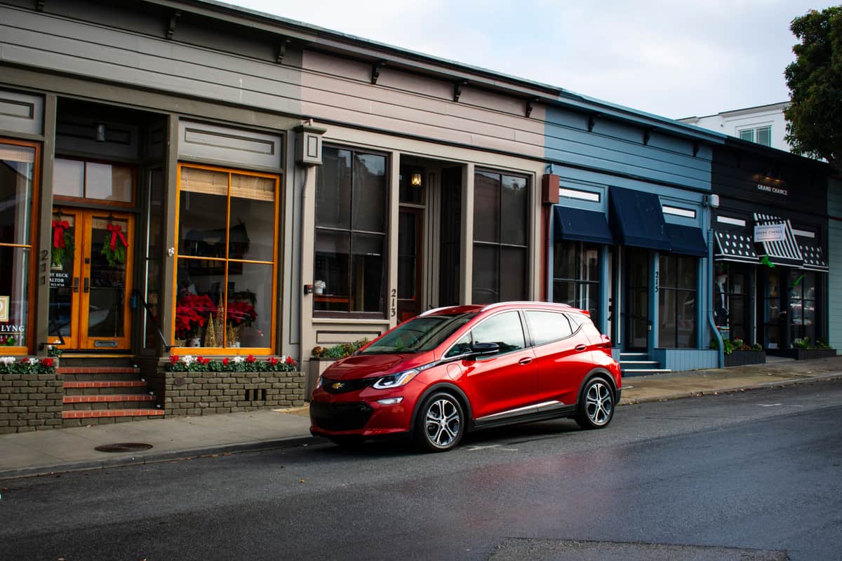A compact electric hatchback parked on a residential street