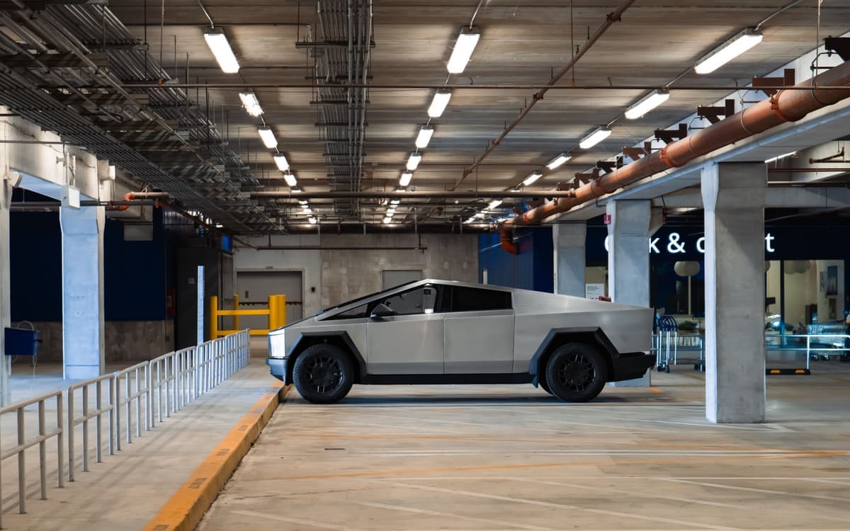 A Tesla Cybertruck parked in a parking garage