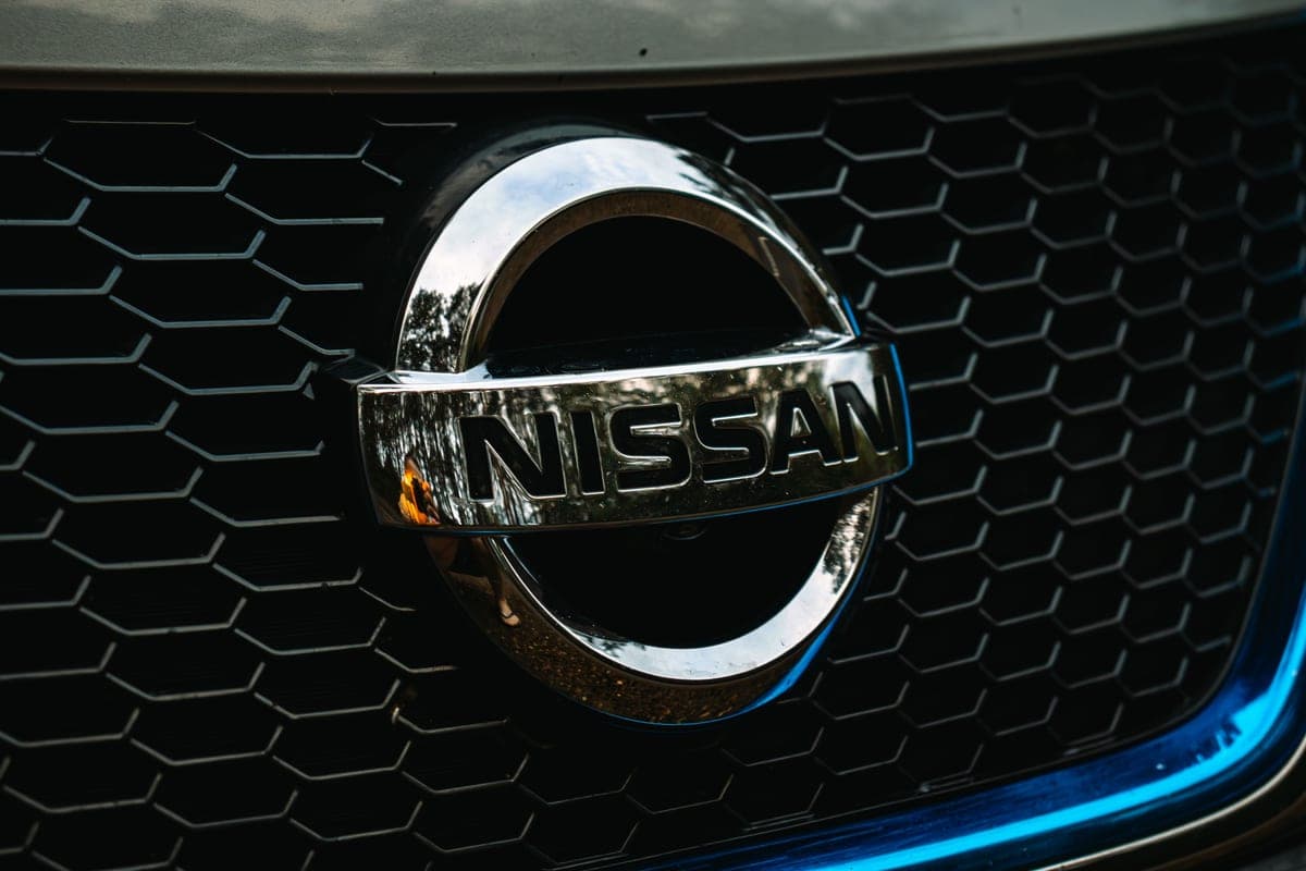 The Nissan badge on a car's front grille